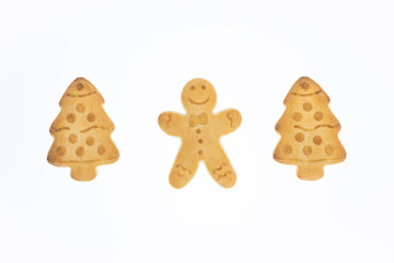 christmas shortbread cookies in the shape of a christmas tree and gingerbread man on a white background, tasty homemade cakes,  christmas recipes, symbol of merry christmas and happy new year