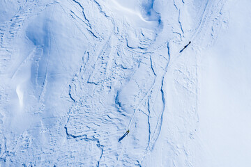 Drone image of mountains in winter. Image with snow, texture and shadows. 