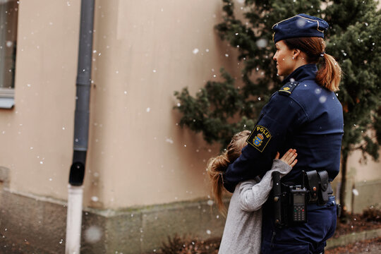 Police Woman Hugging Daughter, Sweden