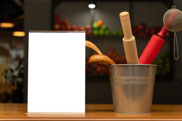 Into the aluminum bucket is a set of various kitchen devices are made of wood. Copy space, space...