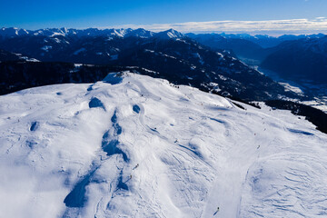 Fototapeta premium Drone image of mountains in winter. Image with snow, texture and shadows. 