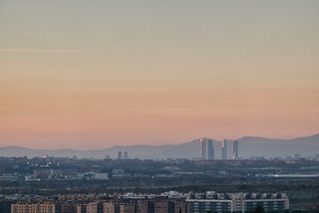 The Madrid Skyline and the Sierra de Guadarrama National Park seen from Cerro del Telégrafo. Madrid's community. Spain
