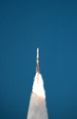 Rocket in the blue sky. The elements of this image furnished by NASA.