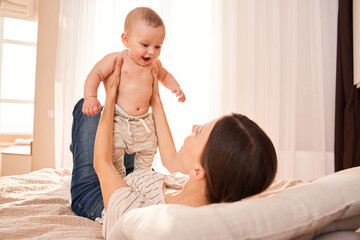 Woman playing with her newborn