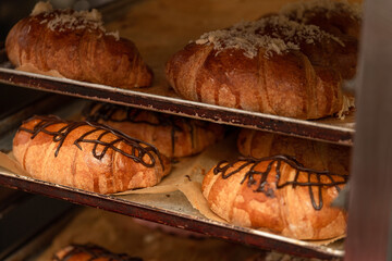 Bakery with various types of pastries, bread and rolls and croissants