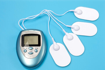 Equipment for electromassage on a blue background