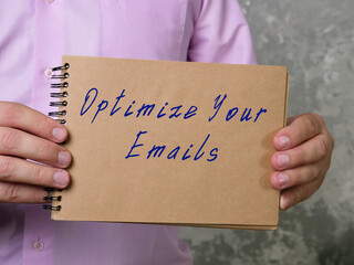 Motivational concept meaning Optimize Your Emails with inscription on the page.