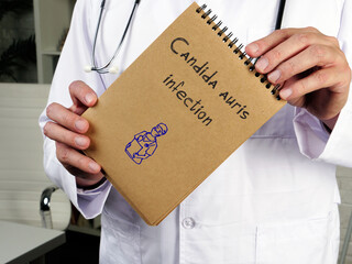 Medical concept about Candida auris infection with inscription on the piece of paper.