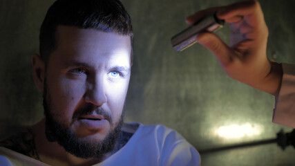 Doctor shines a flashlight mentally ill patient eyes, ripper, murder, coronovirus, zombie