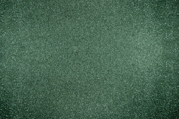 Glitter green background. Photo of monotone shiny background.