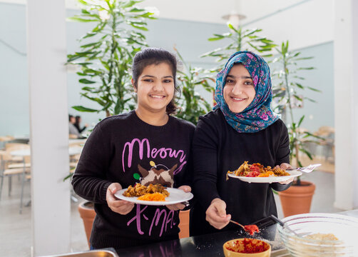 Smiling girls in school canteen, Sweden
