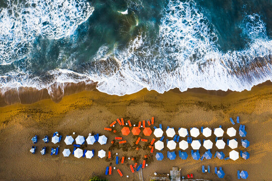 Aerial view of beach umbrellas and sea, Greece