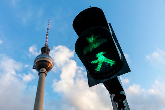 Green Ampelmann (Ampelm&auml;nnchen) on Berlin Traffic Light with Berlin TV Tower in background (Berliner Fernsehturm) August 14th 2017, Berlin, Germany