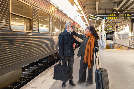 Mature couple on train station platform, Sweden
