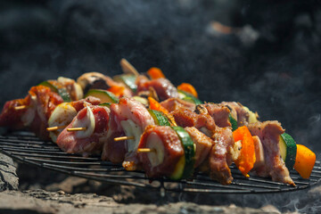 Grilled vegetable and meat skewers with bell peppers, zucchini, onion and mushrooms. Meat and vegetables kebabs on skewers. - 394456092