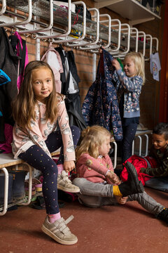 Children getting dressed at school, Sweden