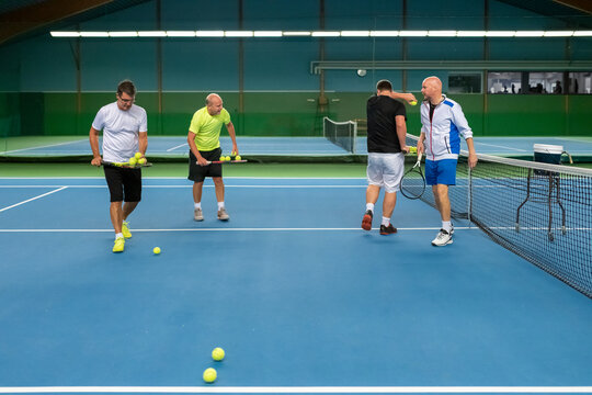 Men at tennis court, Sweden