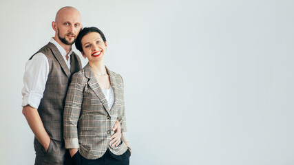 Family look. Hipster casual style. Trend fashion. Confident happy man and woman in posing together isolated on white copy space. Advertising background.
