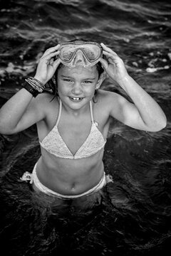 Girl in bikini standing in sea, Sweden