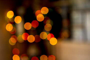 Fototapeta premium Multicolored colorful bokeh lights on abstract dark background.