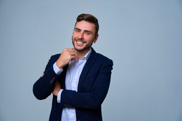 Close up portrait young man businessman. Caucasian guy business suit studio gray background.
