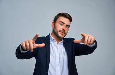 Close up portrait young man businessman. Caucasian guy business suit studio gray background.