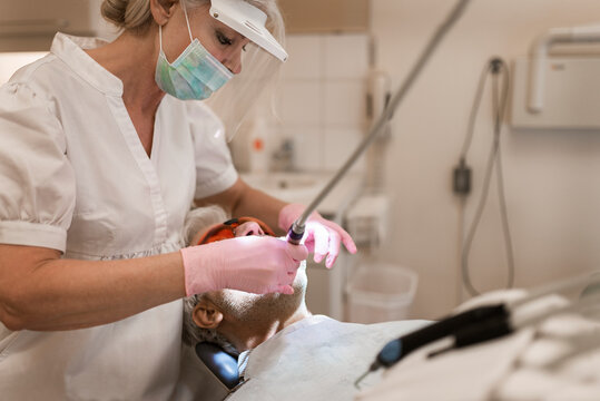 Dentist examining patients teeth, Sweden