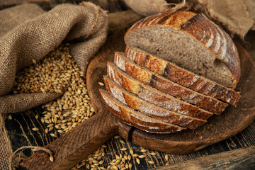 Composition with wholegrain  bread  on wooden board