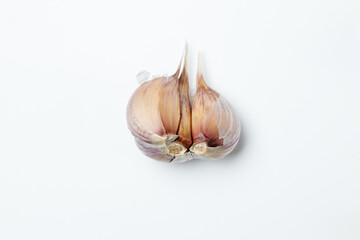 two garlic cloves on a white background