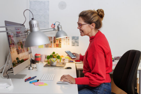 Woman working in office, Sweden