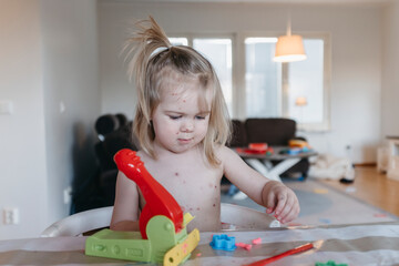 Girl playing play dough, Sweden