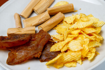 white plate with junk food