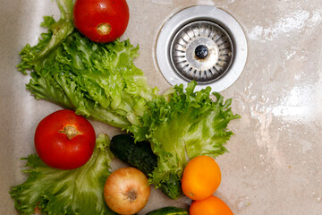 Washing vegetables in the sink