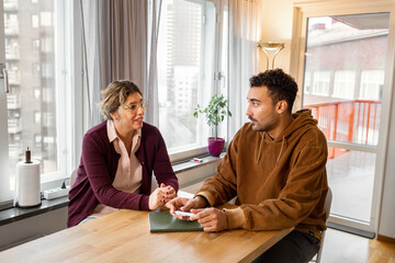 Mother talking with adult son, Sweden