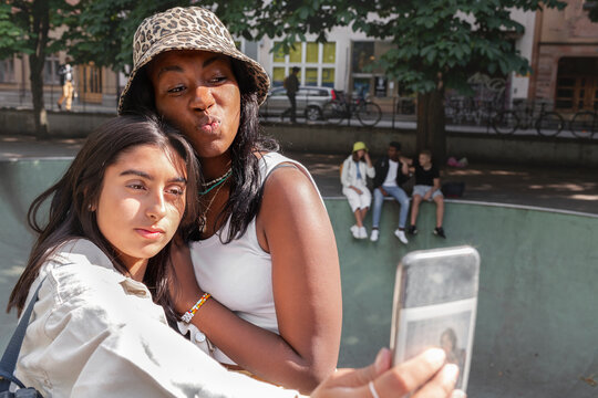 Female friends taking selfie, Sweden