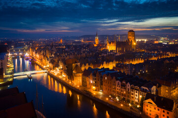 Fototapeta na wymiar Amazing cityscape of Gdansk over Motlawa river at dusk, Poland