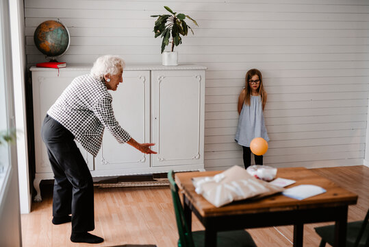 Senior woman throwing ball, Sweden
