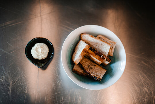 Bread slices and dip on stainless steel background, Sweden