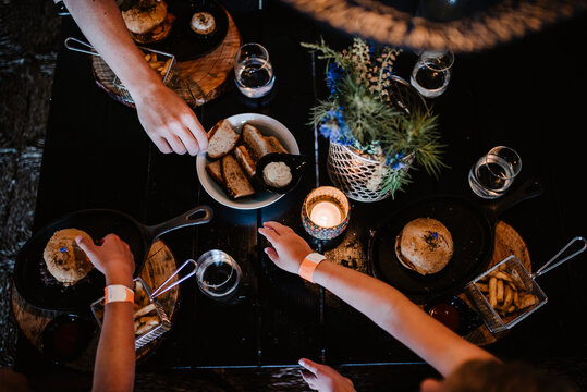 Hands reaching food on table, Sweden