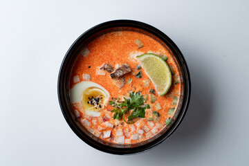 Thai classic tom yum, above view and isolated on white background