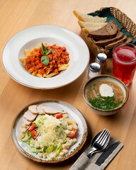 Set lunch in a cafe on wooden table, side top view
