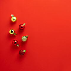 Red golden colorful Christmas tree decoration balls composition on red background