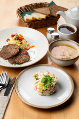 Whole branch on light wooden table, menu photography of different european meals