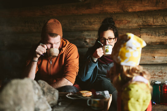 Couple resting with hot drinks, Sweden