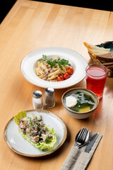 Italian pasta with salad and soup for a siesta lunch in a cafe