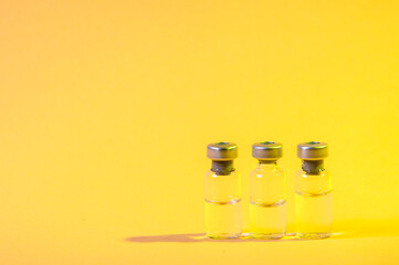 Vials of medicine or vaccine. Vaccination and healtcare concept.