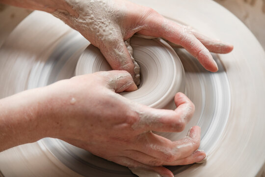Womans hands modeling clay, Sweden