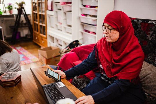 Woman holding cell phone, Sweden