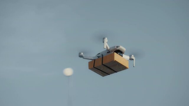 flying on a sky delivery drone with holding a .cardboard parcel