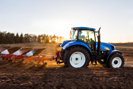 Tractor plowing field, Sweden